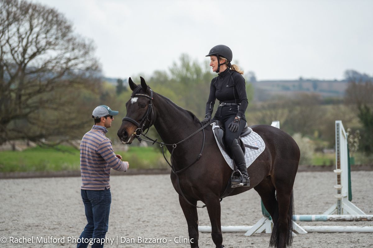 Dan Bizzarro coaching a rider during a clinic session